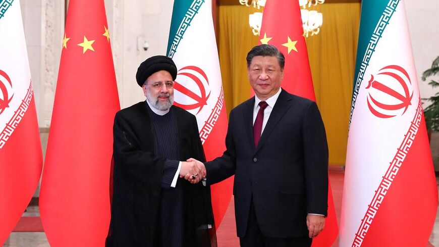 Iranian President Ebrahim Raisi shakes hands with Chinese President Xi Jinping during a welcoming ceremony in Beijing, China, February 14, 2023. Iran's President Website